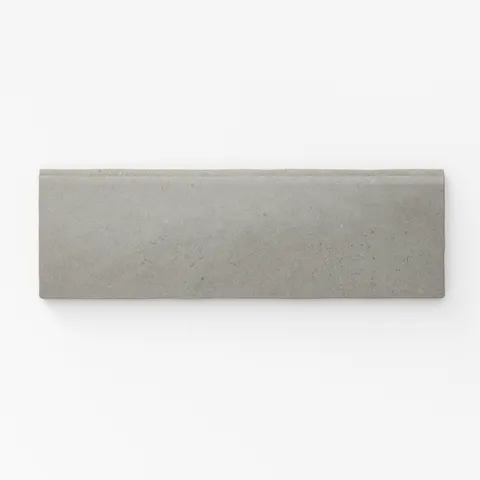 Matte pebble-gray bullnose tile with a smooth, understated finish, perfect for clean, modern edges