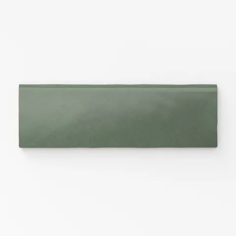Deep green bullnose tile in a matte finish, perfect for seamless edges with a natural touch