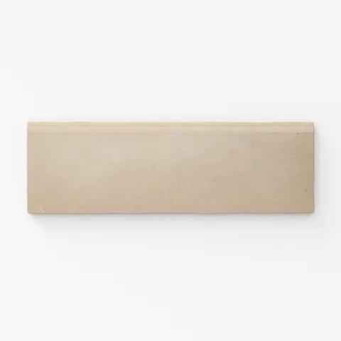 Warm beige bullnose tile with a soft matte finish, offering a subtle elegance for edge detailing or trim accents