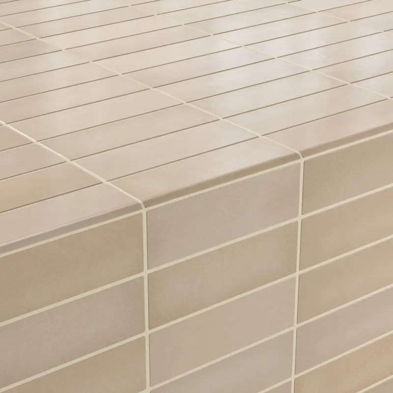 Beige bullnose tiles with a smooth matte finish, seamlessly wrapping edges for a clean and contemporary look