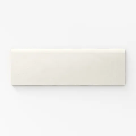 Soft eggshell-white matte tile with refined bullnose edges, perfect for minimalist elegance