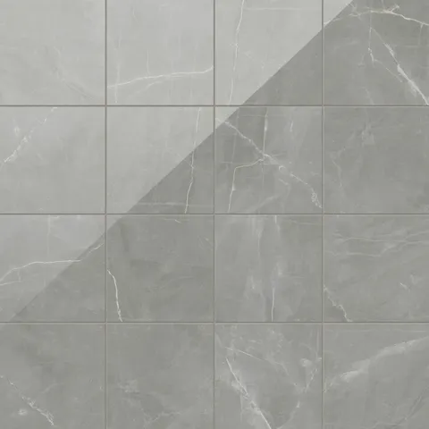 Leona 12x12 polished porcelain tile in Amani Grey, showcasing elegant gray tones with marble-inspired veining.