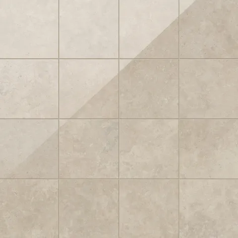 Leona 12x12 polished porcelain tile in Marfil, showcasing soft beige tones with a natural stone-like texture.