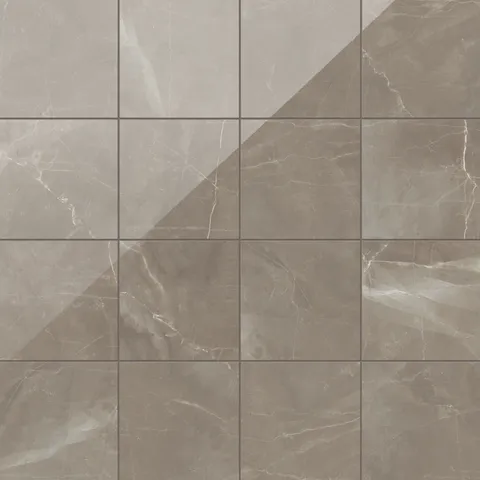 Leona 12x12 polished porcelain tile in Amani Bronze, featuring a rich brown marble finish with delicate white veining.