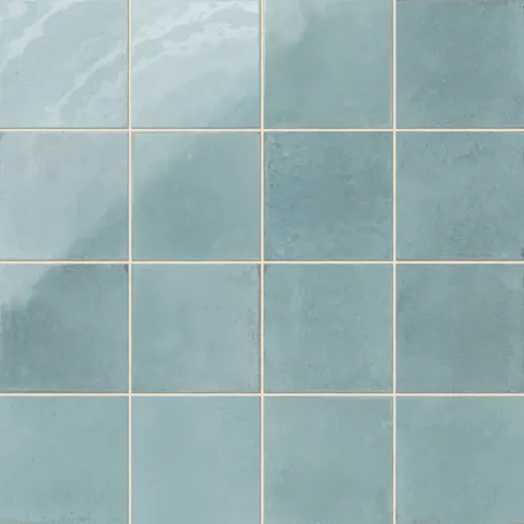 Light blue porcelain tiles featuring subtle shading and a timeworn, artisanal look.