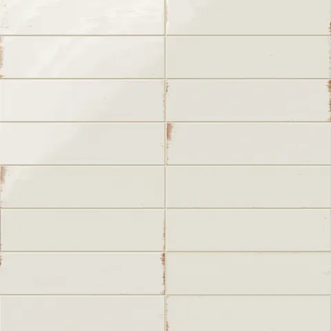 Subway porcelain tiles in soft white with a glossy surface and rustic brown edges.