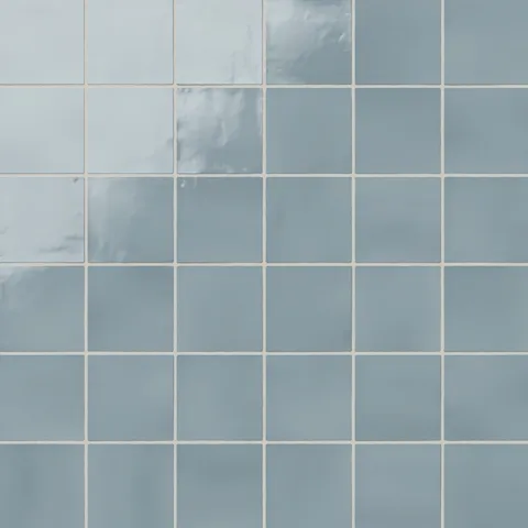 Soft ocean blue 4x4 square ceramic tiles with a smooth, glossy surface, perfect for adding a serene touch to interiors