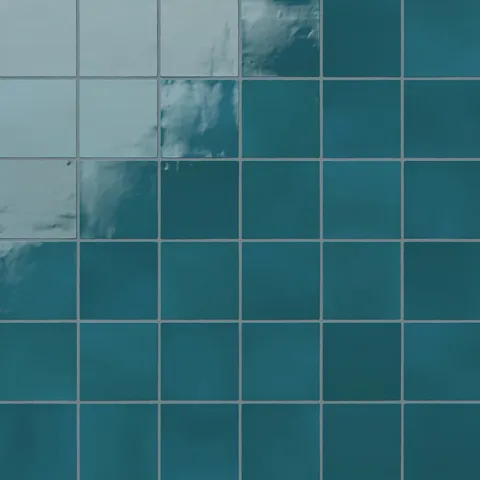 Deep blue-green 4x4 ceramic square tiles with a vibrant, glossy finish, ideal for bold and elegant interior designs