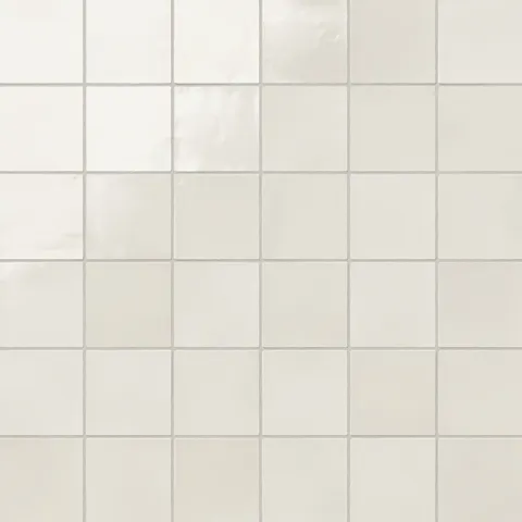 Square 4x4 glossy ceramic tiles in a soft off-white hue with subtle reflections, offering a clean and timeless look for versatile design applications