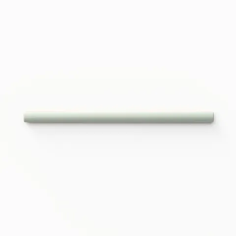Quarter-round porcelain trim tile, featuring a soft pistachio green tone and smooth, glossy finish