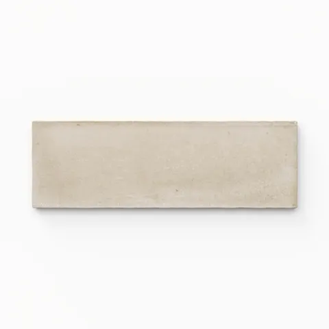A 2x6 porcelain tile in beige, featuring a matte finish, soft tonal variation, and a clean, flat-edge profile.