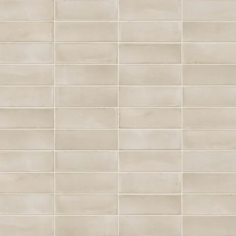 A 2x6 porcelain subway tile in warm beige, featuring a matte finish, and a clean stacked layout with fine grout lines.