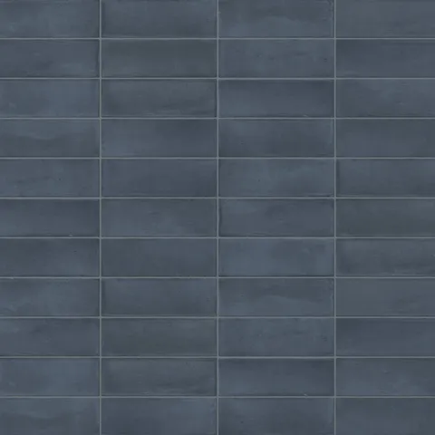A 2x6 porcelain subway tile in deep navy blue, featuring a matte finish, and a clean stacked layout with fine grout lines.