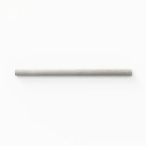 A 0.5x8 ceramic tile trim in misty gray, featuring a glossy finish, and softly curved profile for elegant edging.