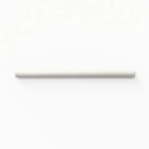 A 0.5x8 ceramic tile trim in off-white, featuring a matte finish, and softly curved profile for elegant edging.