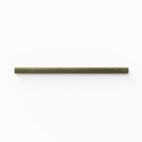 A 1x8 ceramic tile trim in moss green, featuring a matte finish, and softly curved profile for elegant edging.