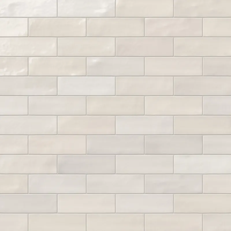 Jojo subway tile in Ivory arranged in a classic brick pattern, showcasing a glossy finish and clean, timeless appeal