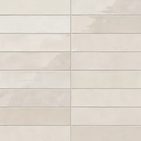 A 3x12 ceramic subway tile in off-white, featuring a glossy finish, and a clean stacked layout with fine grout lines.