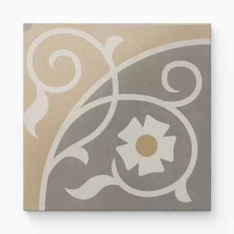 An 8x8 matte porcelain decorative tile featuring a vintage floral scroll in soft beige and grey, centered by a stylized daisy with a warm ochre core.