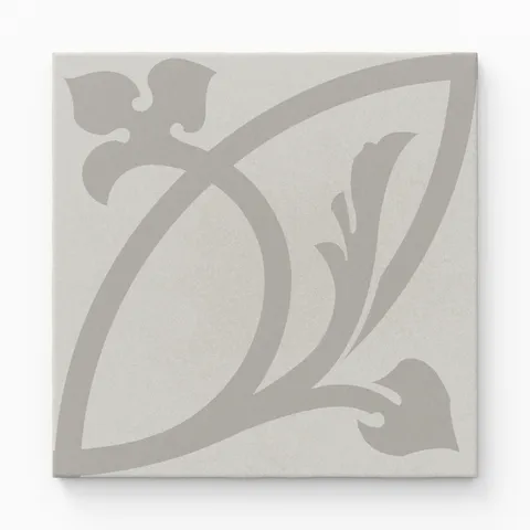 An 8x8 matte porcelain decorative tile in soft grey with a sweeping, stylized floral motif in a muted tone-on-tone palette for elegant, understated charm.