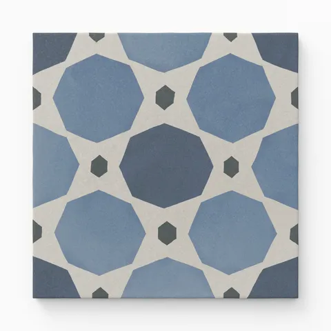 An 8x8 matte porcelain decorative tile with blue-toned interlocking octagonal shapes in gradient navy and sky blue, connected by off-white diamonds and small charcoal hexagons.