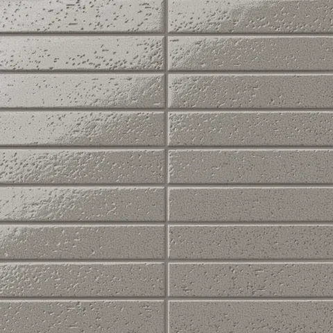 Glossy gray 2x10 subway tile with a handcrafted look, featuring subtle texture variation and a stacked layout for a refined, modern finish.