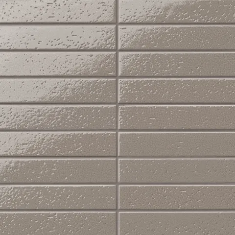 Glossy, earthy brown 2x10 subway tile with a handcrafted appearance, subtle texture variation, and a stacked layout for a clean, modern look.