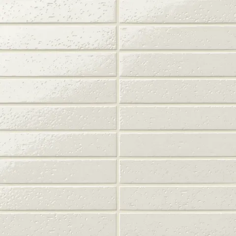 Beige textured glossy subway tile in a 2x10 size, arranged in a horizontal stack pattern with subtle surface variation for a handcrafted look.