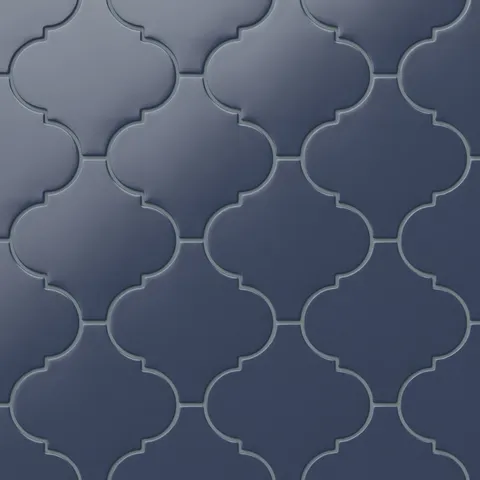 Jasmine 8x8 satin porcelain tile in navy, featuring a signature lantern shape and arabesque pattern. The velvety satin finish adds elegance to walls or floors in any indoor or outdoor space.
