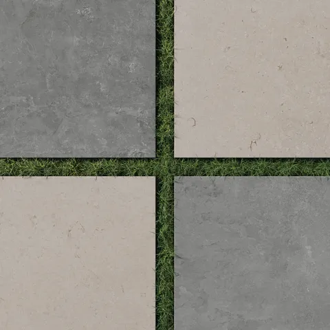 Large format porcelain pavers in dark gray and light brown set in grass, offering a bold stone look checkerboard with earthy elegance and slip resistance.