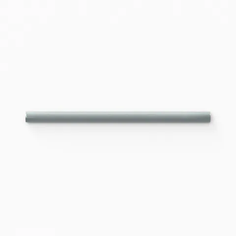 Glossy ceramic pencil trim in soft blue-gray, providing a refined edge detail with a smooth, polished finish for seamless tile transitions.