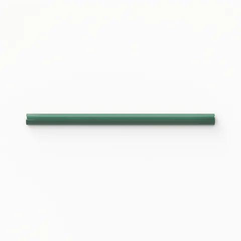 Glossy ceramic pencil trim in deep green, offering a sleek finishing touch with smooth edges for polished tile installations.