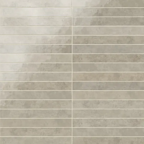 Rectangular porcelain wall tile in a glossy finish with a smooth, lightly textured surface, featuring a warm light gray color with subtle natural variation.