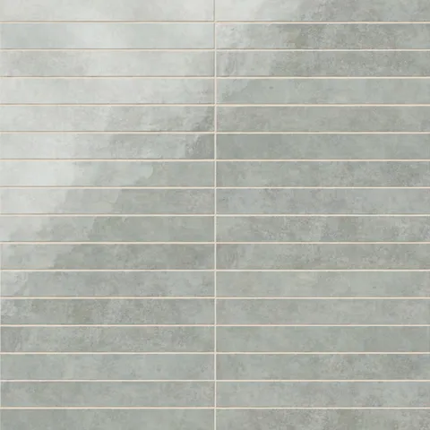Rectangular porcelain wall tile in a glossy finish with a smooth, lightly textured surface, featuring a cool light gray color with soft natural variation.