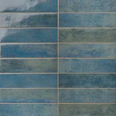 Glossy tiles in blue-gray tones with subtle texture and natural variation for a rich, handcrafted look.