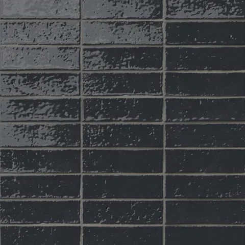 Handmade brick tiles with a gleaming dark blue glaze, subtle dimples, pinholes, and organic surface variation.