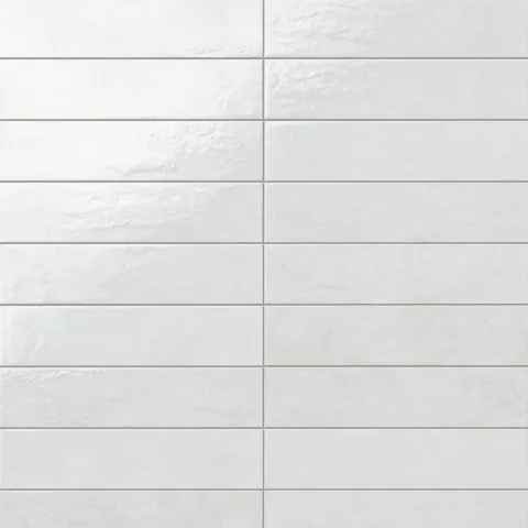 Inspired by Mediterranean design, these glossy white porcelain tiles feature gentle surface variation and a luminous finish that suits coastal, spa-like, and relaxed modern spaces.