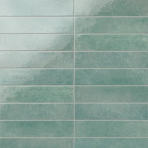 Featuring a glossy, artisan-inspired finish, this seafoam porcelain tile moves between soft blue-greens and weathered hues, bringing a relaxed coastal feel to kitchens and baths.