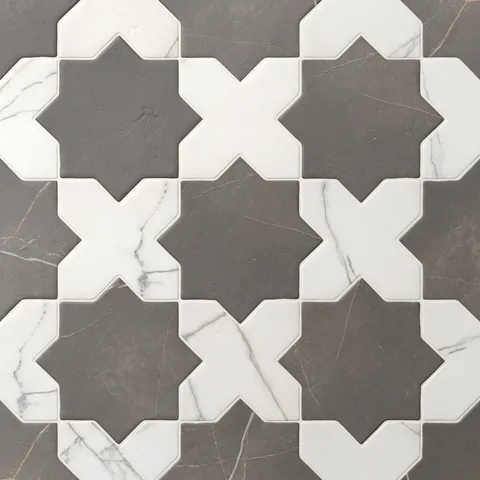 Dark gray and white Aslan 6x12 porcelain tiles in star and cross shapes show gentle veining across a matte finish and softened edges, perfect for kitchens or accent walls.
