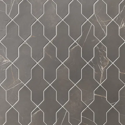 Shield-shaped Aslan 2x8 porcelain tiles in dark gray create a rhythmic layout, featuring subtle veining, a matte surface, and gently softened edges.