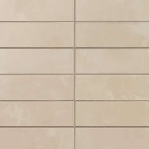 Soft warm beige porcelain subway tiles offer subtle shade variation and a powdery glaze, giving walls a calm, inviting look that suits bathrooms and timeless kitchen designs.