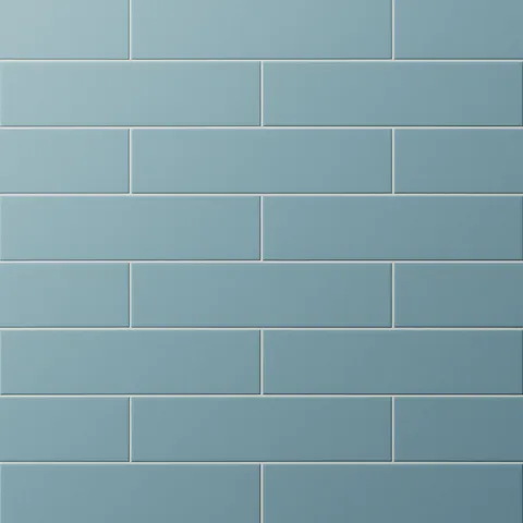 Earthy blue subway tiles in a classic offset pattern, adding a fresh, coastal vibe to kitchens or bathrooms.
