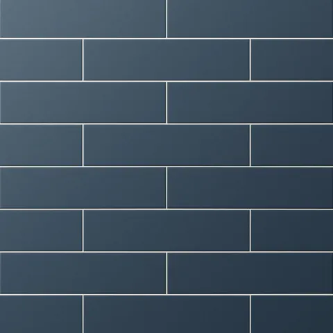 Matte navy blue subway tiles in a classic offset pattern, offering rich depth and modern sophistication to interior walls.