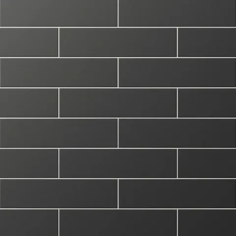 Matte black subway tiles in a staggered layout, delivering bold contrast and modern elegance to walls or backsplashes.