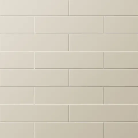 Matte beige subway tiles in a classic offset pattern, bringing soft warmth and timeless elegance to any wall surface.