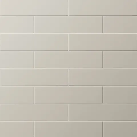 Matte light taupe subway tiles in a timeless offset layout, perfect for creating a clean, neutral backdrop.