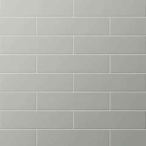 Matte earthy gray subway tiles in a classic offset layout, offering a sleek, modern look with subtle sophistication.