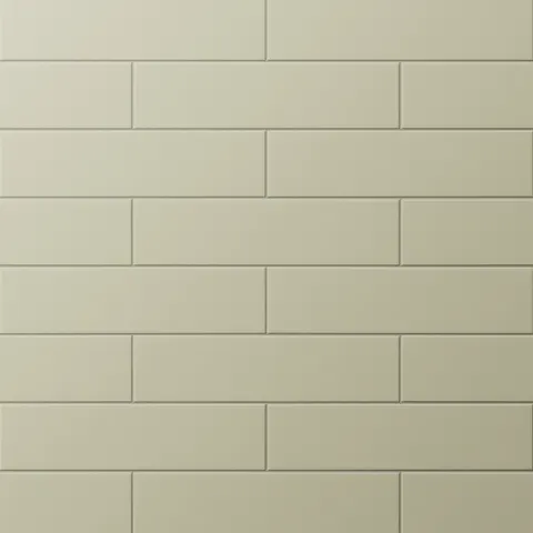 Muted green subway tiles arranged in a staggered layout, bringing warmth and subtle elegance to modern interiors.