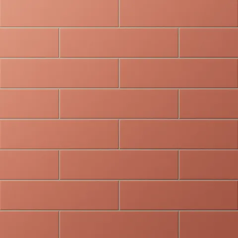 Matte subway tiles with earthy red hue in a classic offset layout, adding warmth and rustic charm to walls or backsplashes.