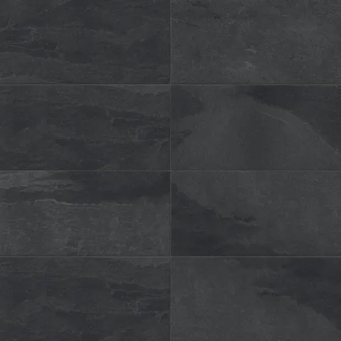 Matte rectangular tile in black and dark gray tones with deep stone-like texture and natural variation, ideal for bold, contemporary interiors and busy areas.
